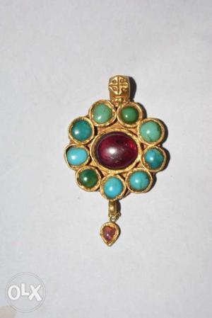 The necklace piece with stone is around 400+ year