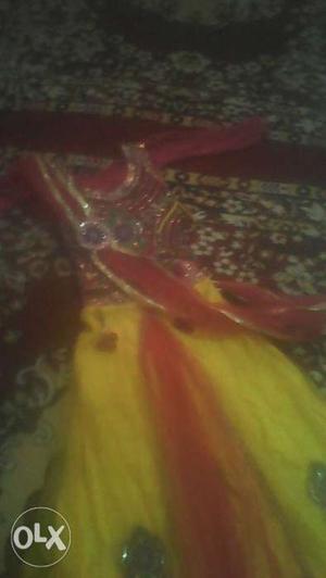 This is lehnga in yellow and pink colour with full sleeves