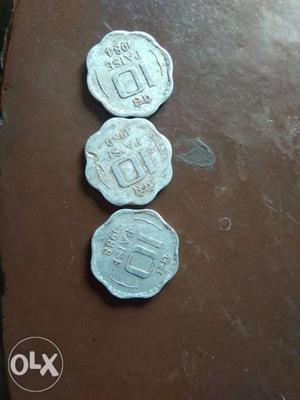 Three Silver-colored 10 Indian Paisa Coins
