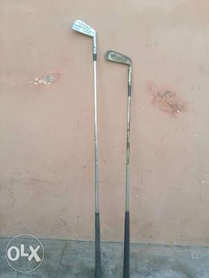 Two Gray Golf Putters