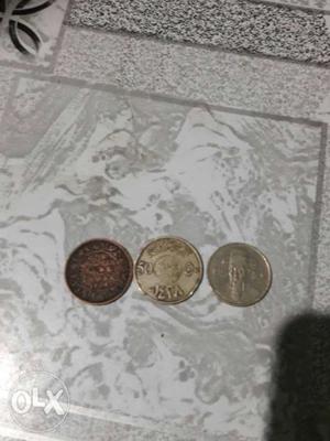 Two Silver-colored And One Copper-colored Coins