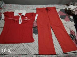 A combination of red shirt and pant,both in brand