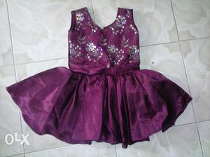 Magenta color frock with bow on the back, Aged: