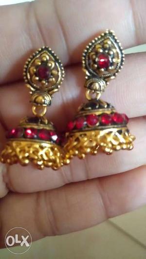 Pair Of Gold-colored-and-red Gemstone Jhumka Earrings