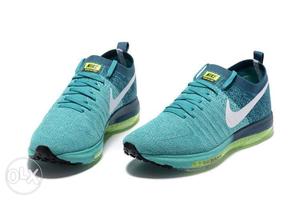 Pair Of Teal Nike Low-top Sneakers