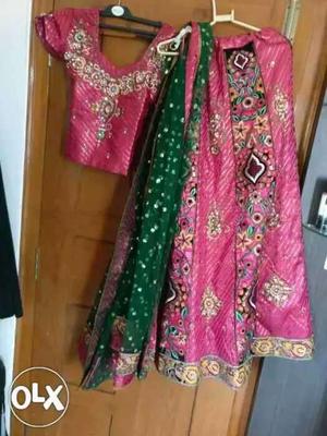Pink lehnga with stone work all over with green