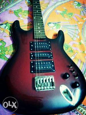 1 year old Red-burst Double-cutaway Electric Guitar