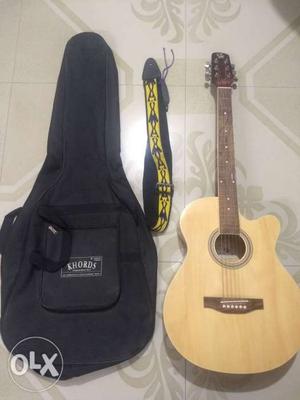 Beige And Brown Acoustic Guitar With Black Bag