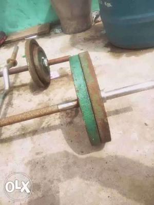 Green And Brown Metal Barbell Plates