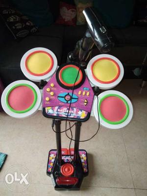 It's a kids electronic drum set with sticks and a