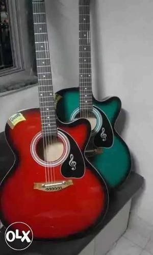Red And Green Cut-away Acoustic Guitars