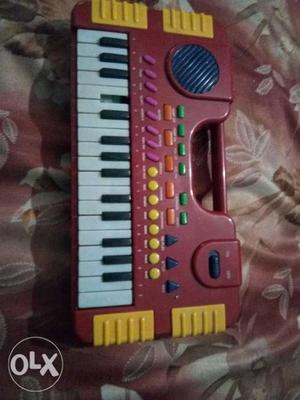 Red And Yellow Plastic Electronic Keyboard Toy