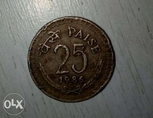 Round  Copper-colored 25 Indian Paise Coin