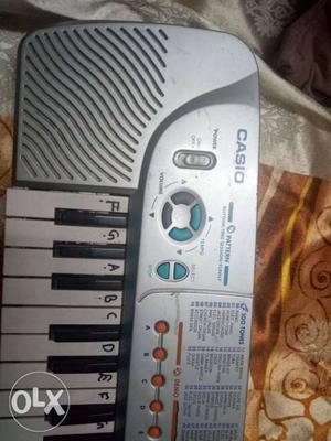 Silver And Black Casio Electronic Keyboard