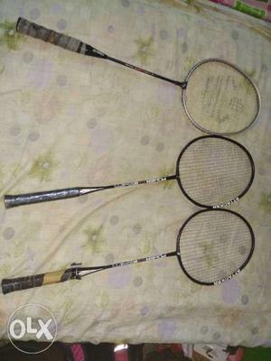 Three Black Badminton Rackets