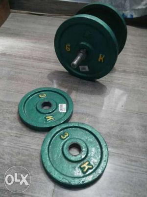 Two Black And Green Barbell Plates