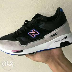 Unpaired Black, Gray, And White New Balance Low-top Sneaker