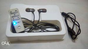 Black Earbuds With White MP3 Player