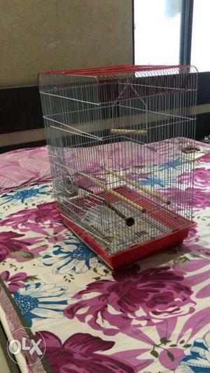 Gray Steel Bird Crate With Red Plastic Frame