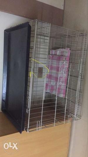 Stainless steel animal cage.
