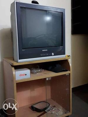 T.V. fully functional with remote. TV table also