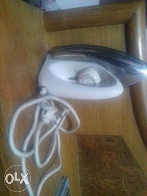 White And Gray Corded Clothes Iron