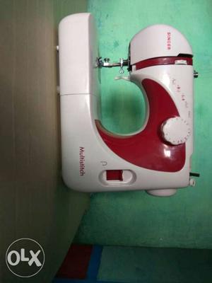 White And Red Electric Sewing Machine