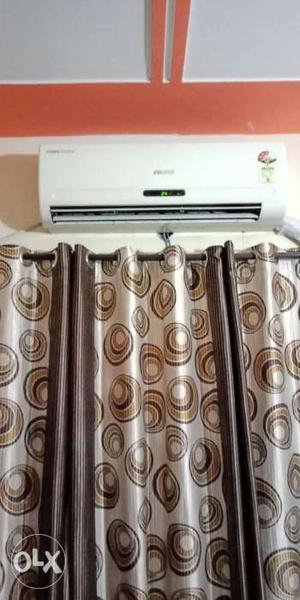 White Split-type AC Unit And Brown And Gray Curtain