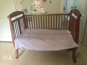 Almost new wooden cot/day bed with side drop and