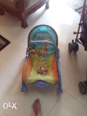 Baby's Green And Blue Stroller