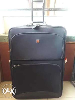 Black colour suitcase with wheels and expandable