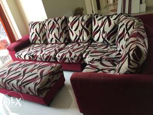 L shaped sofa with ottoman in good condition.