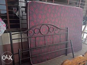 Metal framed bed with mattress.. Two years old
