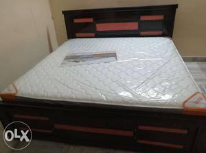 White And Black Mattress With Brown Wooden Bed Frame