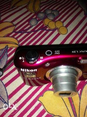 Black And Red Nikon Camera.. with charger... all good
