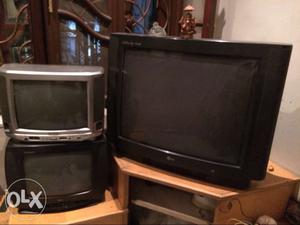 Black CRT TV With Brown Wooden TV Hutch