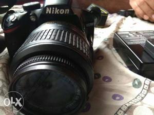 Black Nikon  Small lens mm with charger and carry