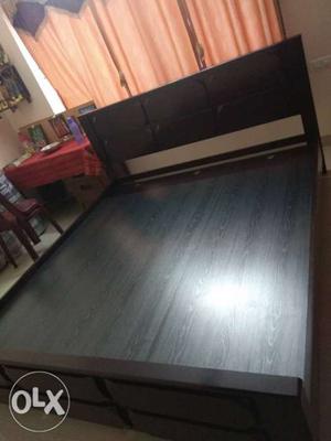 King sized solid wood bed from home town.