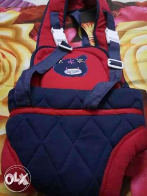 Baby's Red And Blue Carrier