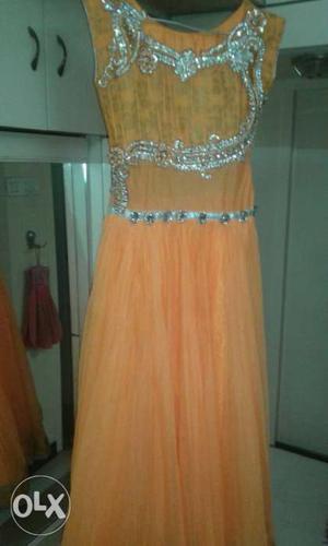 Orange fanta elegant gown with stone work