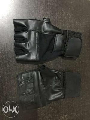 Pair Of Black Leather Fingerless Gloves