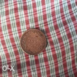 Round Copper-colored 1 Quarter Anna Coin
