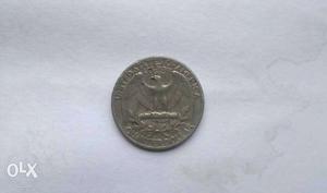 Round Silver-colored 1/4 U.S. Dollar Coin