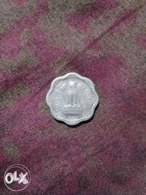 Scalloped Silver-colored Indian Coin