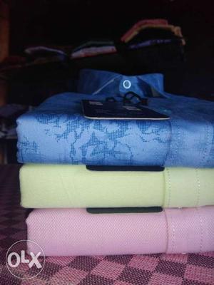 Three Blue, Yellow, And Pink Dress Shirts