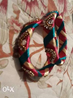 Two Red-and-blue Threaded Bangles