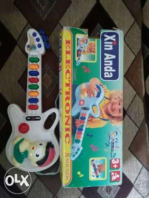 Xin Anda Electronic Guitar Toy With Box