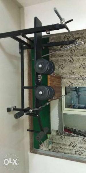 Black Weight Bench With Black Dumbbells