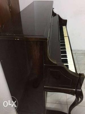 Brown And White Upright Piano