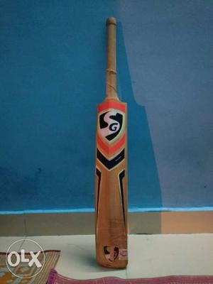 Brown, Black, And Orange SG Cricket Bat